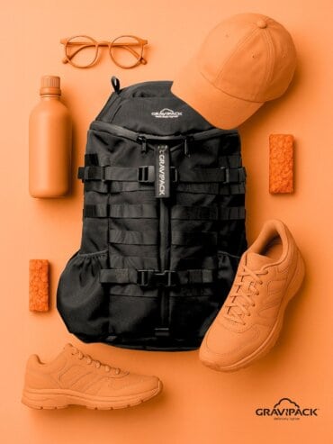 Sac à dos QVT entreprise GRAVIPACK posé avec compartiments et système de portage visibles