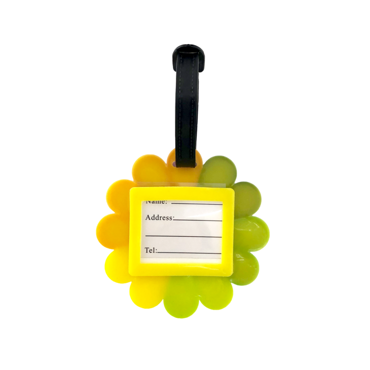 Porte-nom Gravipack fleur arc-en-ciel vu de dos avec étiquette nominative pour valise et sac à dos