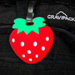 Porte-nom Gravipack en forme de fraise pour valise, sac à dos et bagage cabine