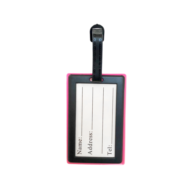 Porte-nom Gravipack « Let’s Go » rose vu de dos avec étiquette d’identification pour valise